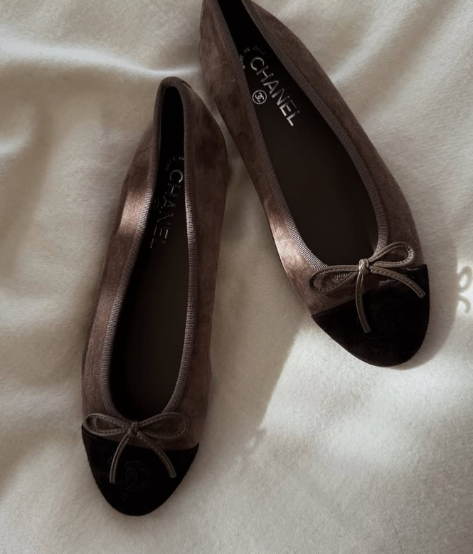 Black ballet flats on silk