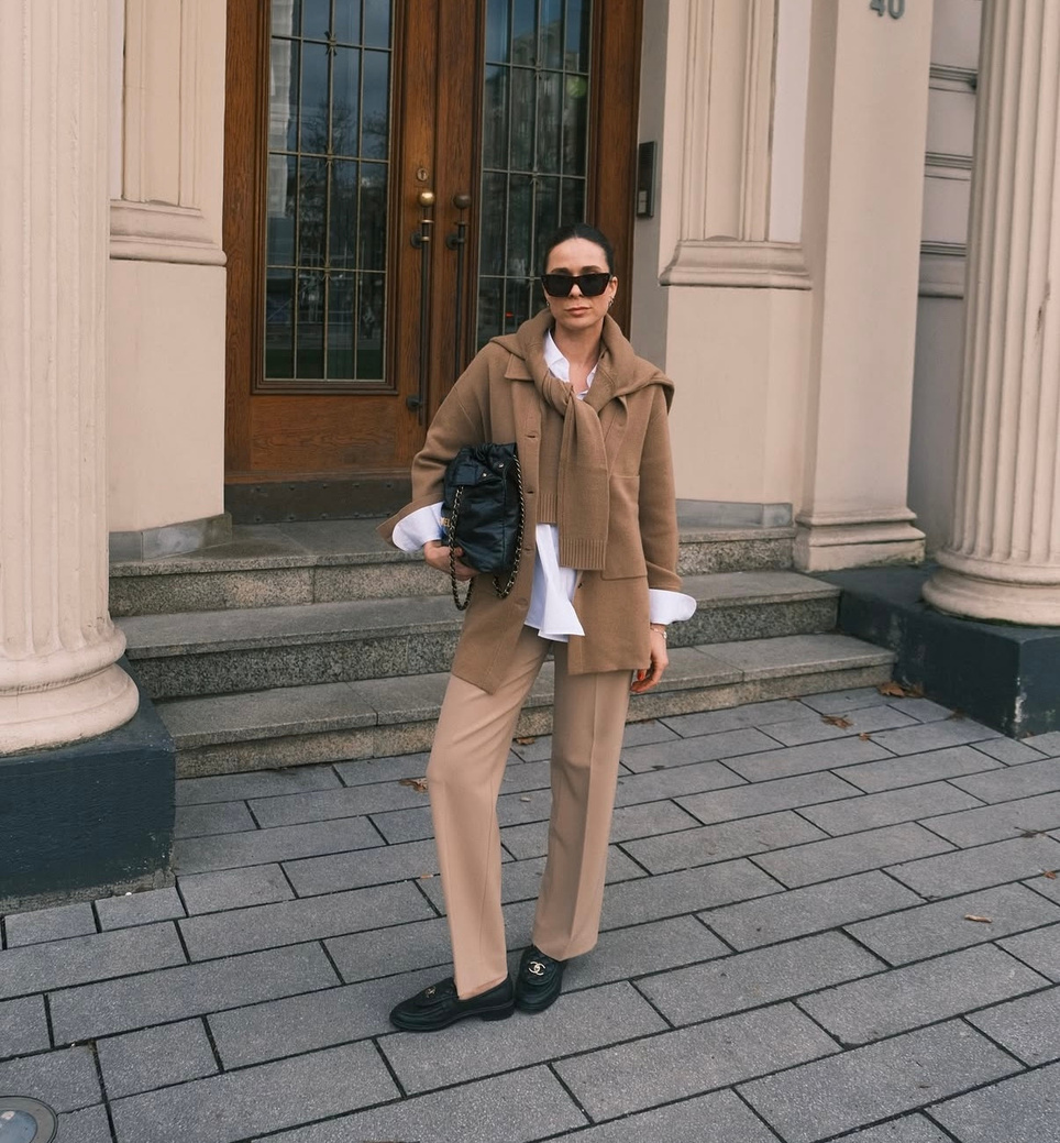 Woman in a tailored camel outfit